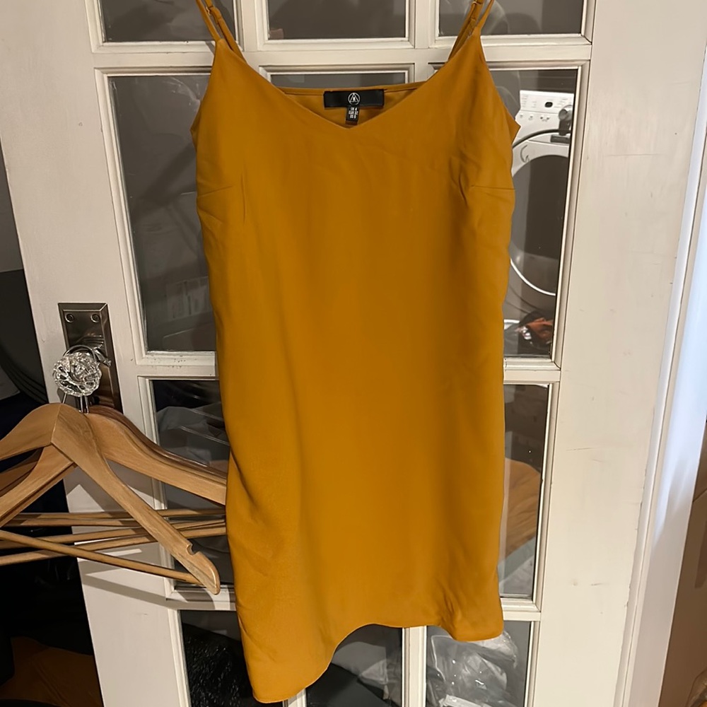 Cute mustard yellow cami dress. Perfect for spring and summer!